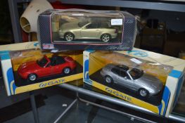 Three Boxed 1:18 Scale Model Cars