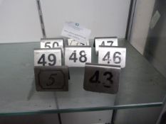 Eight Metal Table Numbers