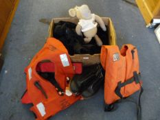 Three Life Jackets and a Pair of Rubber Steel Toe