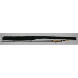 A 9ft 6in Blagdon fibre glass two piece fishing rod, with cork end, in velvet bag.