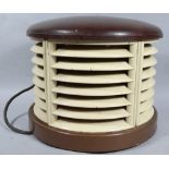 A mid 20thC Art Deco Bakelite heater, of D-end outline with a slatted centre on plain base, with