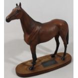 A Beswick standing figure of Red Rum, matt Connoisseur model, on named wooden plinth base, 35cm