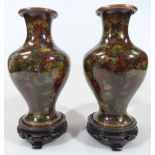 A pair of 20thC Chinese cloisonné vases, each shouldered inverted body profusely decorated with