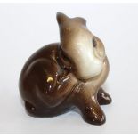 A Beswick rabbit, with black England stamp and numbered 824, 6cm high.