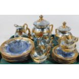 A Venetian enamelled blue glass coffee service, enriched with gilt and floral enamels, comprising