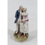 An early 20thC porcelain figure group, of a lady and gentleman on a part crumb coated naturalistic