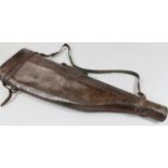 A 20thC leg of mutton leather gun case, with fixed leather handle, part fitted interior and swing