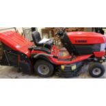 A modern Westwood T50 four wheel ride on tractor lawnmower, in red and black trim, 113cm high.