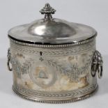 An Edwardian silver plated tea caddy, of oval form with a dome top lid centred with urn knop, the