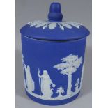 A Wedgwood dark blue Jasperware jar and cover, typically decorated with acorn finial, lift off lid