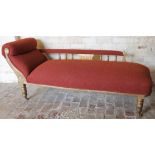 An early 20thC carved walnut framed chaise longue, with scroll side, fixed back, carved