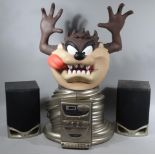 A Taz Hard Rock café style compact disc Tasmanian Devil, with character head providing the CD player