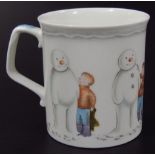 A Royal Doulton The Snowman Gift Collection Building The Snowman mug, printed marks beneath, 9cm