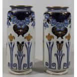 A pair of early 20thC Crown pottery Doris pattern vases, each of cylindrical outline with compressed