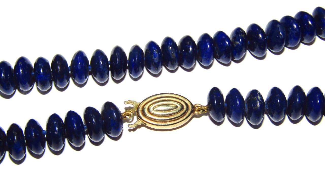 A lapis lazuli necklace with stud earrings, each bead of circular form, on blue string, with a - Image 3 of 3