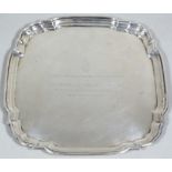 An American salver, of shaped pie crust outline, engraved to the centre with Admiralty badge and