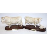 A Royal Doulton Charolais bull, on wooden plinth, unglazed, 18cm high, and a Royal Doulton Charolais