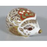 A Royal Crown Derby paperweight ornament, Mistletoe, gilt stopper and printed marks beneath, 5cm