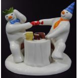 A Coalport Characters The Snowman figure group, Pulling A Cracker, printed marks beneath, 10cm
