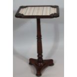 An early Victorian mahogany occasional table, with scroll spandrels, embroidered centre, baluster