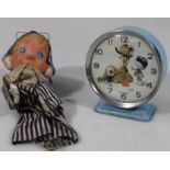 A mid 20thC Bayard Magic Roundabout alarm clock, with articulated 10cm dia. dial in blue trim, and a
