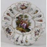 A 20thC Continental Meissen style plate, in the manner of Kauffmann, centred with a courting couple,