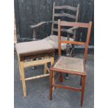 A 19thC rush seated and slat back arm chair, with shaped arm supports on turned front legs