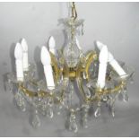 A 20thC moulded glass chandelier with eight branches, centred by an inverted baluster column, with C