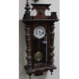 A late 19thC walnut cased Vienna wall clock, in the manner of Gustav Becker, with 14cm dia. Roman