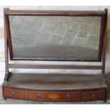A 19thC mahogany toilet mirror, the rectangular glass flanked by block supports raised above a D-end