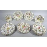 A 20thC Continental faience style part dessert service, comprising of plates and a shaped dish, each