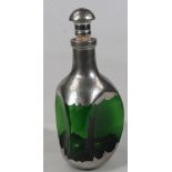 A Royal Holland green glass and hammered pewter decanter, with compressed mushroom and cork style