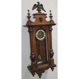 A late 19thC walnut cased Vienna wall clock, the 14cm dia. dial fitted in a three part glazed case