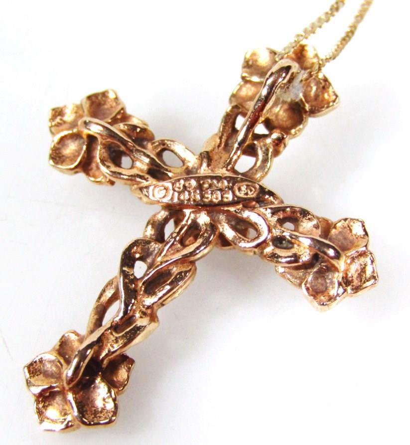 A gold crucifix pendant, on a fine link chain, the crucifx with floral design, set with tiny diamond - Image 2 of 2