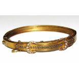 A Victorian bangle set with pearls, with belt clasp, 7cm wide.