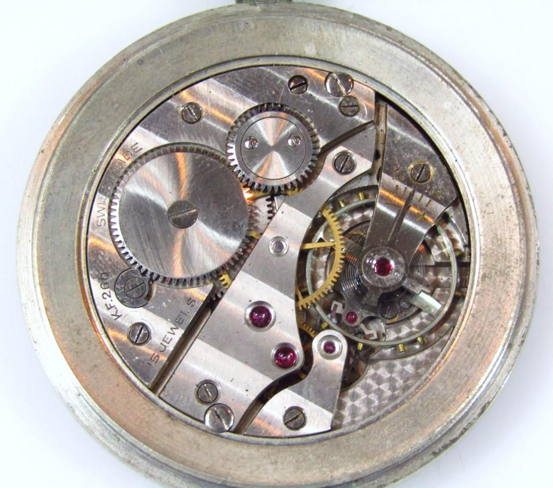 A mid 20thC war issue chrome plated open faced pocket watch, the 5cm dia. dial, with Arabic numerals - Image 3 of 3