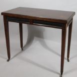 A 19thC rosewood fold over games table, with (later) leather insert raised above a gadrooned