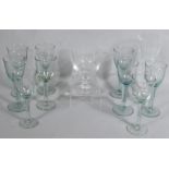 A suite of nine early 20thC Victorian style wine glasses, each with bell shaped bowls, clear stems