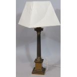 A modern table lamp, with brass Corinthian column on stepped base with modern cream shade, 84cm