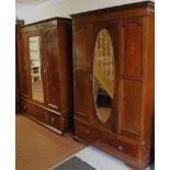 A late Victorian mahogany harlequin bedroom pair, comprising triple and double wardrobes, each