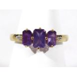 A 9ct gold dress ring, set with purple and white stones, each claw set, with pierced setting, 1.9gms