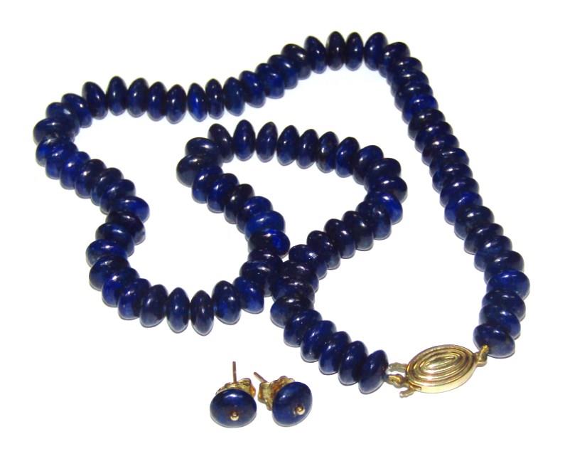 A lapis lazuli necklace with stud earrings, each bead of circular form, on blue string, with a