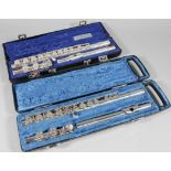 A 20thC Charter House three piece flute, chrome plated in fitted case, 40cm wide, and another by