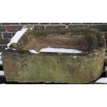 A 19thC pump stone pump trough base, of D-end outline, with open well, 25cm high, 79cm wide, 65cm