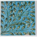 A William De Morgan tile, in green on turquoise ground, Stamp End seal mark beneath, 15cm high,