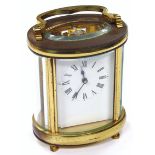 An early 20thC carriage clock, of oval outline, the rectangular 5cm wide plate with Roman numerals
