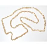 A natural pearl necklace, with various shaped pearls, each of a pink/cream colour, 45cm long,