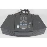 A Bose Wave radio/CD player, in black trim, 37cm wide, model AWRC3G.