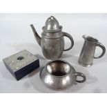 An early 20thC Arts & Crafts Tudric pewter matched three piece service, comprising coffee pot,
