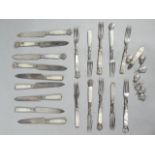 A set of early 20thC silver plated and mother of pearl entrée knives and forks, bright cut
